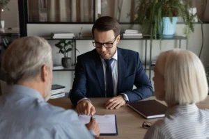 A snapshot of an experienced insurance claim lawyer assisting clients, depicting the process of handling insurance claims